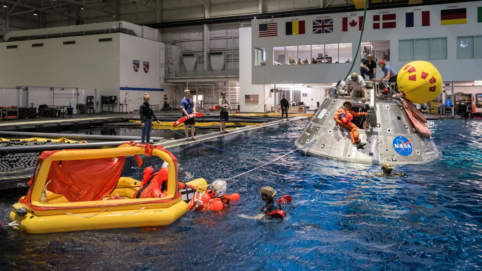 Artemis II crew conducting Orion water-survival and recovery training in NASA’s Neutral Buoyancy Laboratory.